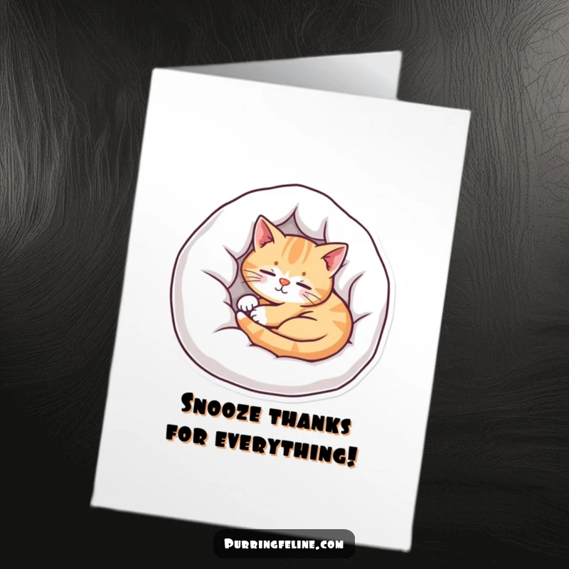 Free printable thank you card featuring a snug cat nestled in its bed, radiating contentment and thanks.